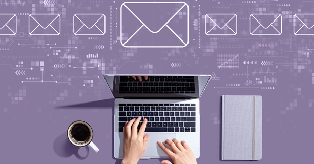 A laptop with email icons